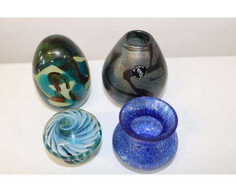 A shelf full of art glass including Mdina. The Mdina piece is 10cm tall 