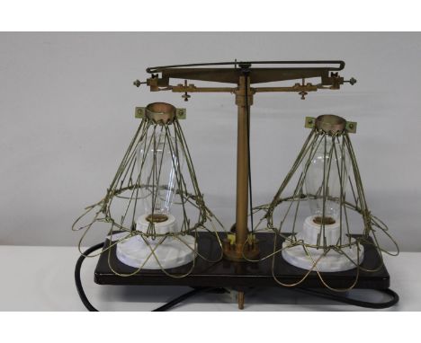 An unusual set of scales transformed into a table lamp in GWO 