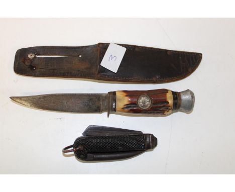 A Naval military jack knife with a German sheath knife with a compass in the handle 