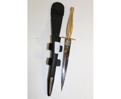 A Fairbairn Sykes Commando fighting knife with etched pattern to blade pattern 2 brass handled with scabbard 