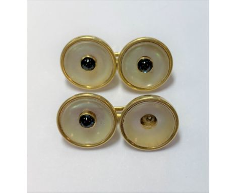 each 15mm mother-of-pearl disc centrally set with a round cabochon sapphire (one lacking), detachable hook connectors, unhall