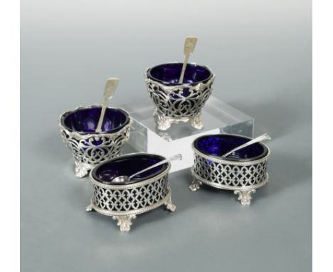 the first by Thomas Tongue, Birmingham 1877, of oval form with pierced sides and beaded edges, raised on four cast scroll fee