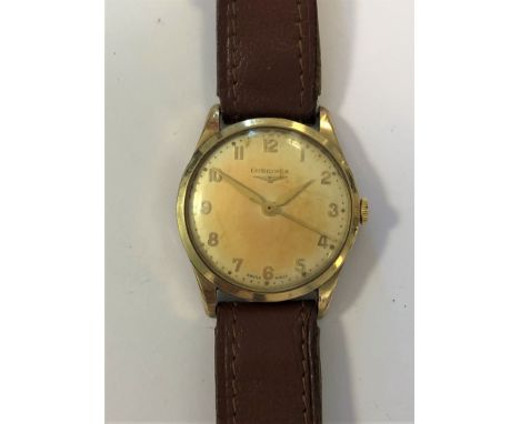 c1953, the signed cream coloured dial, 28mm diameter, with gold coloured Arabic numerals, hands and centre sweep, signed mech