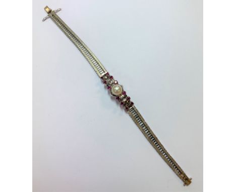 with a central 8mm cultured pearl flanked by six graduating round faceted rubies either side, mesh style slightly graduating 