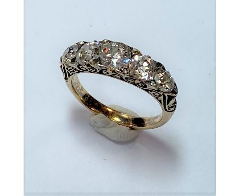 five graduating old cut diamonds, estimated total approximate weight 1.50ct, claw set and spaced with (originally) ten rose c