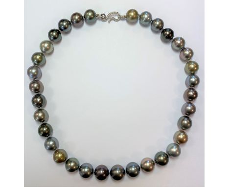 thirty three pearls, with a central pearl of 13.9m graduating to 12mm, of natural colour in delicate shades including grey, p