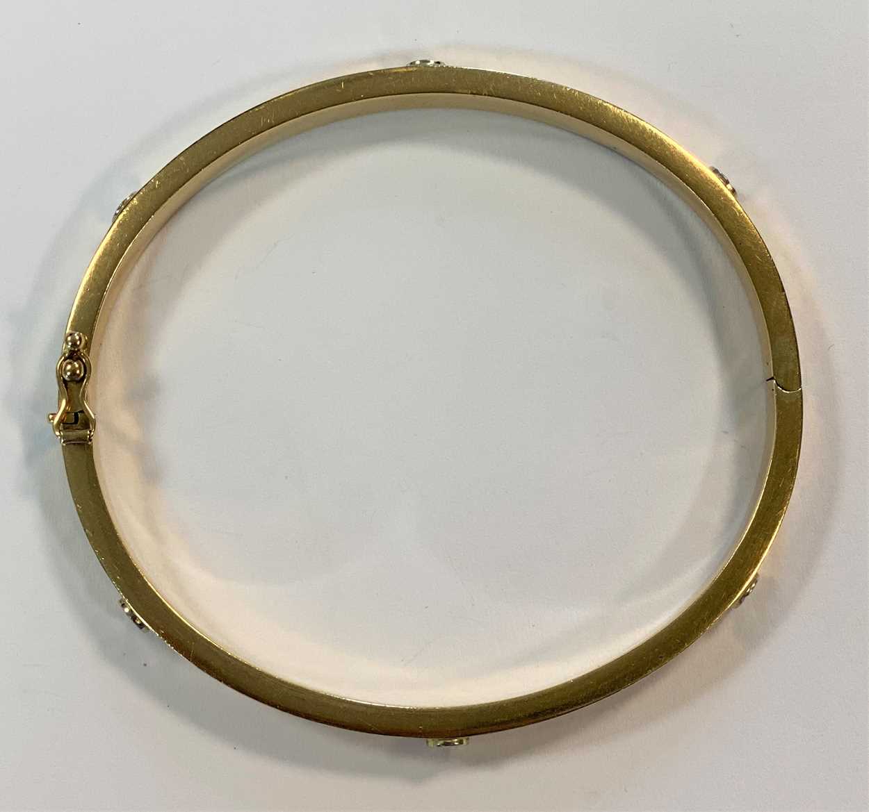 A Cartier style decorative bangle, in - Cheffins Fine Art