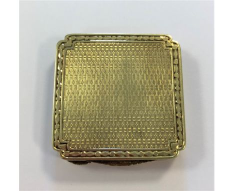 the square box with slightly canted corners, decorated all over with engine turned engraving within an engraved 'dot and dash