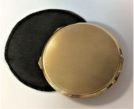 by Adie Brothers Ltd, Birmingham 1947, of circular form and decorated all over with engine turned engraving, two thumbpieces,