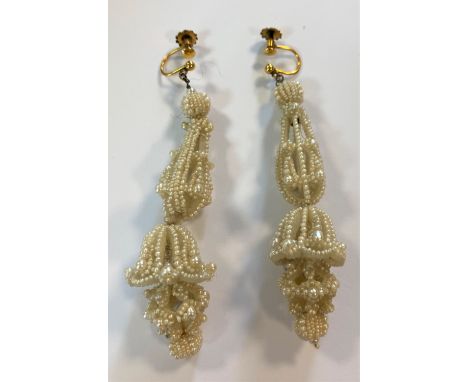 each suspended from a seed pearl ball and a delicate pear shaped drop with seed pearls attached to a mother-of-pearl frame, l