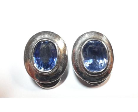 each rubover set with an oval faceted light purplish blue sapphire, approximately 8.4 x 6.8mm, estimated approximate total we