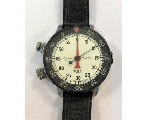 c1960, the signed white dial, 45mm diameter, with black Arabic numerals, blued centre sweep and red minute counter, rotating 