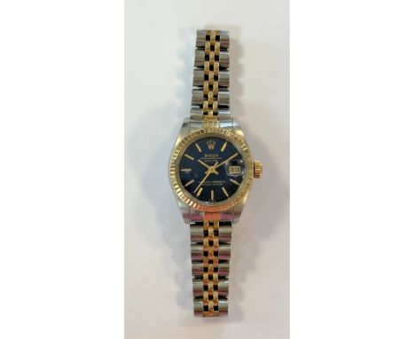 c1991, model 69173, serial number X179505, the signed dark blue metallic finished dial, 20mm diameter, with gold coloured bat