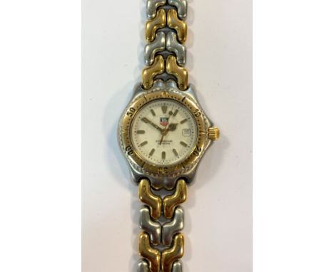 c1990, model WG1322-2, the signed white dial, 20mm diameter, with gold coloured batons and hands, centre sweep, date window a