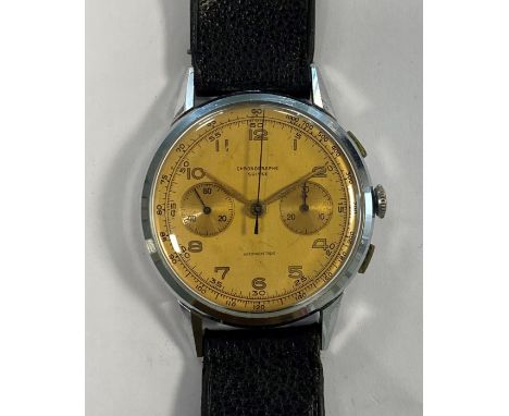 c1950, the signed tan coloured dial, 34mm diameter, with gold coloured Arabic numerals and hands, subsidiary running seconds 