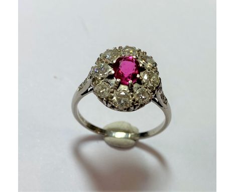 central oval faceted pinkish red bright and lively transparent ruby, estimated approximate weight 0.75ct, claw set above a bo