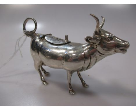 stamped 'Sterling 925', with oversized horns, the hinged saddle with thumbpiece, decorated with a resting fly and with raised