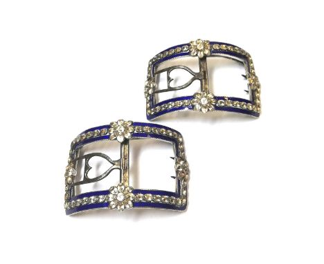 the buckles of strict rectilinear design, each set with a border of colourless paste and decorated with blue enamel, dimensio