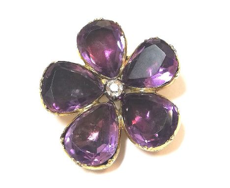 central claw set old brilliant cut diamond, estimated approximate weight 0.20ct, surrounded by five rubover set pear shaped a