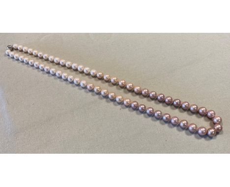sixty three pearls, with a central pearl of 15.5mm graduating to 11.5mm, of natural colour and graduating from white to candy