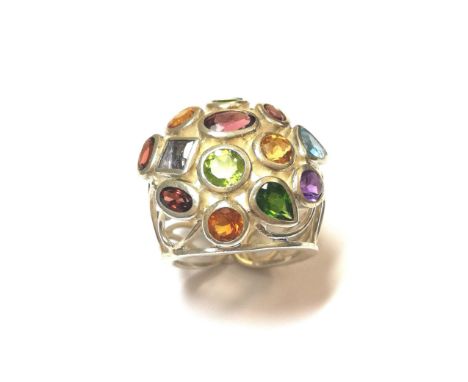 including garnet, peridot, citrine and topaz, all rubover set with open work abstract design shoulders, size K, unmarked whit