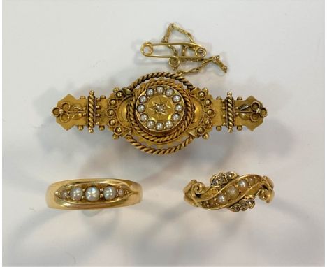 the first, an Edwardian seed pearl and diamond target and bar brooch with applied wire decoration, pin and hook fitting with 