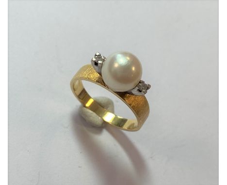 central 8mm pearl, flanked by two small eight cut diamonds, tapered shoulders with a bark finish, flat shank, size M, stamped