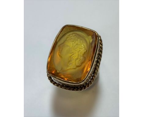 rubover set rectangular cushion faceted citrine featuring a female portrait intaglio, 19.1 x 14.7mm, rope twist border, 'D' s