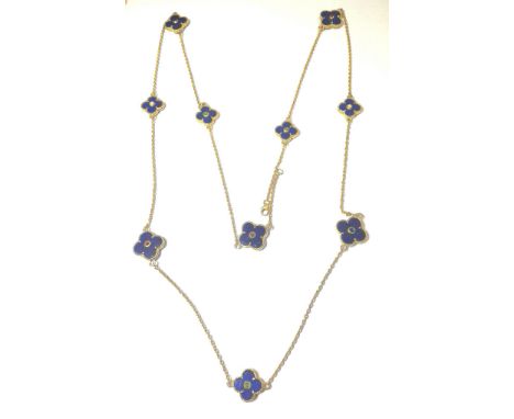 the ten flat lapis plaques, alternating larger and smaller, claw set in patterned collets, the centres of each rubover set wi