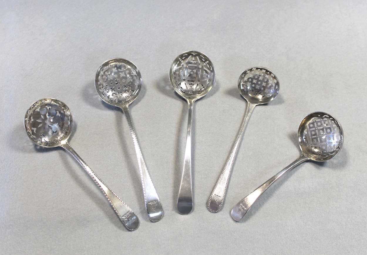 A II silver sugar sifting spoon together with four early