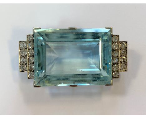 claw set rectangular step cut aquamarine, 27 x 20mm, estimated approximate weight 43.00ct, each side decorated with ten old c
