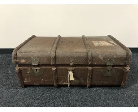 An early 20th century wooden bound travelling trunk 