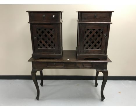 A contemporary hardwood two-drawer console table together with a pair of bedside cabinets with lattice doors