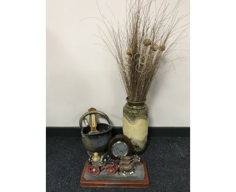 A West German stick pot with sticks, brass coal receiver, two barometers and a figure of five alarms on wooden plinth 