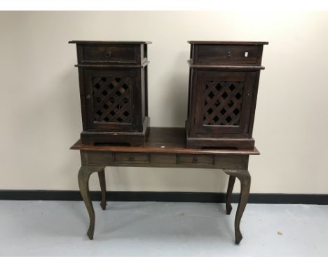 A contemporary hardwood two-drawer console table together with a pair of bedside cabinets with lattice doors