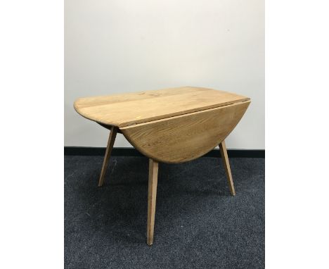 An Ercol elm drop leaf table 