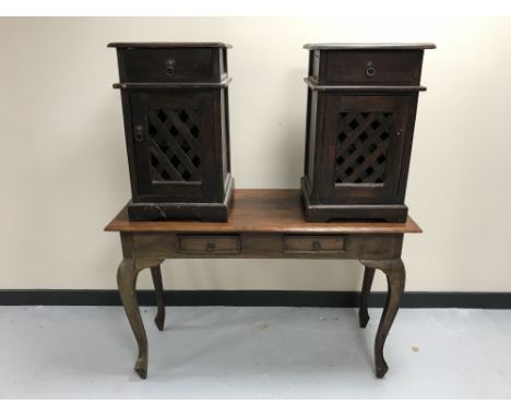 A contemporary hardwood two-drawer console table together with a pair of bedside cabinets with lattice doors