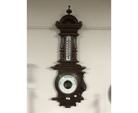 A heavily carved barometer