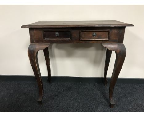 A contemporary hardwood two-drawer console table