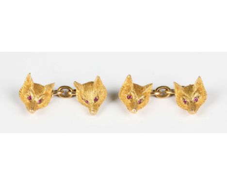 A pair of Alabaster &amp; Wilson gold and ruby fox mask cufflinks, each fox's mask with ruby set eyes, detailed '9ct A&amp;W'