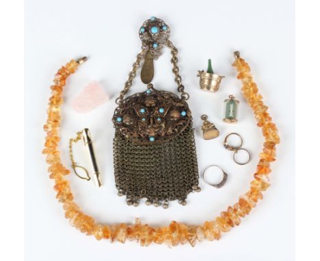 Four 9ct gold charms, comprising a one pound note, a champagne bucket, a pair of rings and a pendant fob, total weight 16.3g,