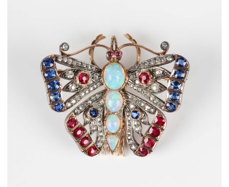 A late Victorian gold backed and silver set, diamond, ruby, sapphire and opal brooch, designed as a butterfly with outspread 