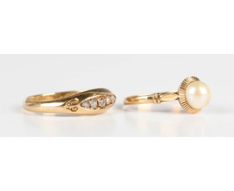 An Edwardian 18ct gold and diamond five stone ring, mounted with a row of graduated cushion cut diamonds in a boat shaped set