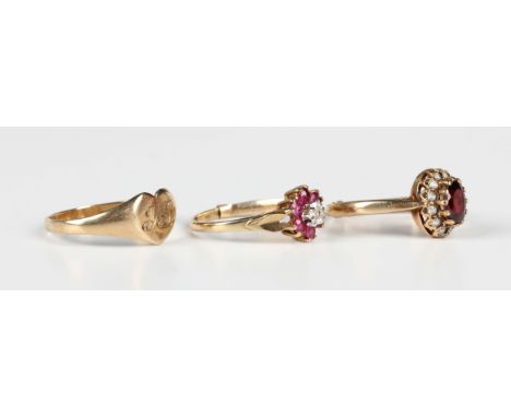 A 9ct gold, ruby and diamond seven stone cluster ring, London 1986, fitted with a sizing band, ring size approx K1/2, a 9ct g