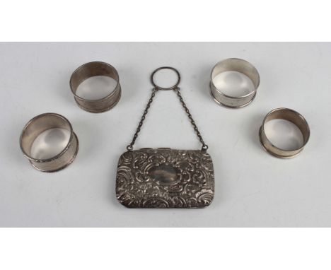 A George V silver purse, embossed with flowers and 'C' scrolls, fitted with a chain and suspension ring, Chester 1910 by S. B