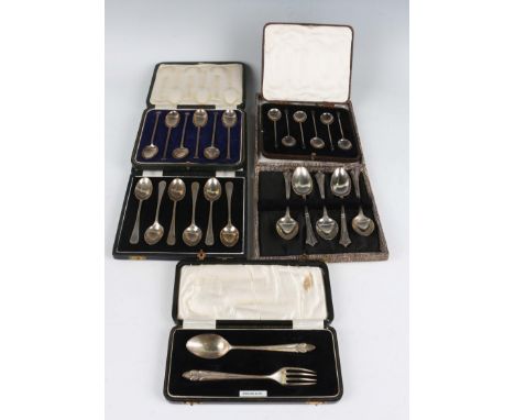 A set of six George V silver nail head coffee spoons, Sheffield 1921, cased, a set of six silver bright cut engraved teaspoon