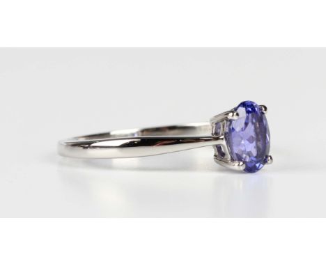 A platinum ring, claw set with an oval cut tanzanite, detailed 'PT950', weight 3.4g, ring size approx R1/2.Buyer’s Premium 29