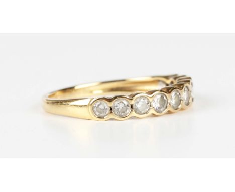 An 18ct gold and diamond half hoop eternity ring, mounted with a row of ten circular cut diamonds, detailed '0.50', weight 2g
