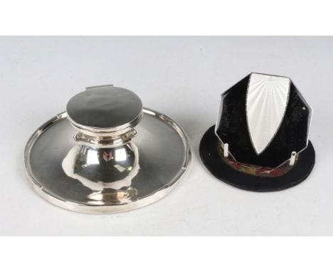 A George V silver capstan inkwell with hinged lid and glass liner, Birmingham 1922, diameter 15.2cm, and a silver and enamell