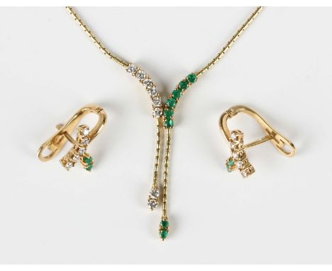 A gold, emerald and diamond pendant necklace, the front in an abstract design, mounted with circular cut diamonds and emerald